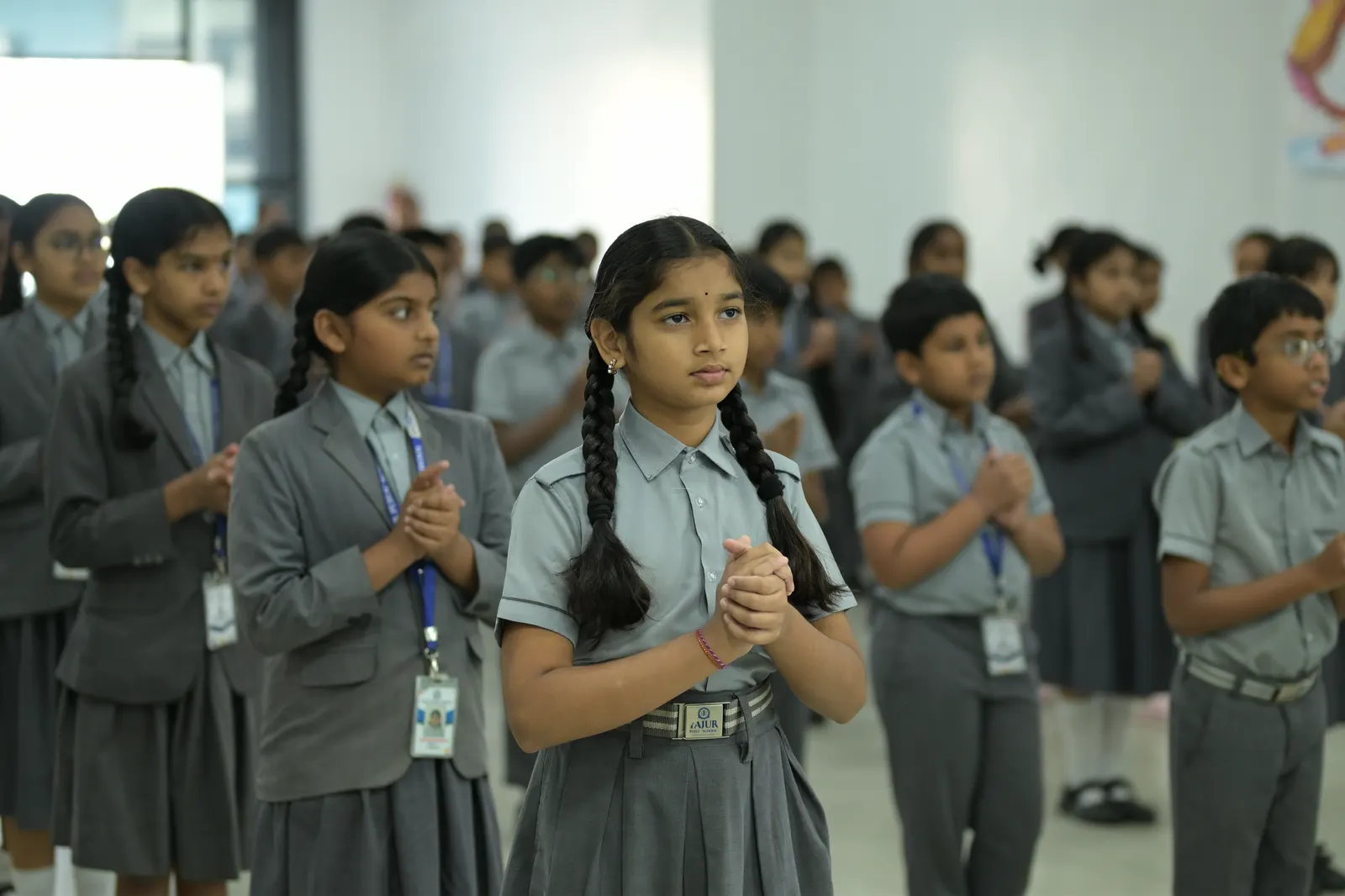 Students lined up in the school corridor at morning assembly