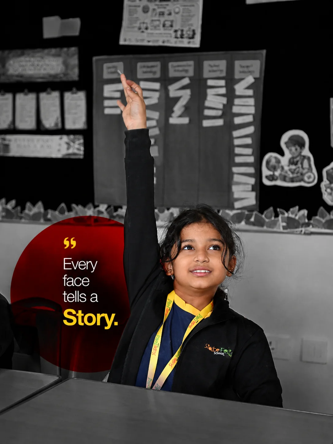 A student raising her hand in class, the frame desaturated except for her school lanyard and a red disc carrying the line “Every face tells a Story.”